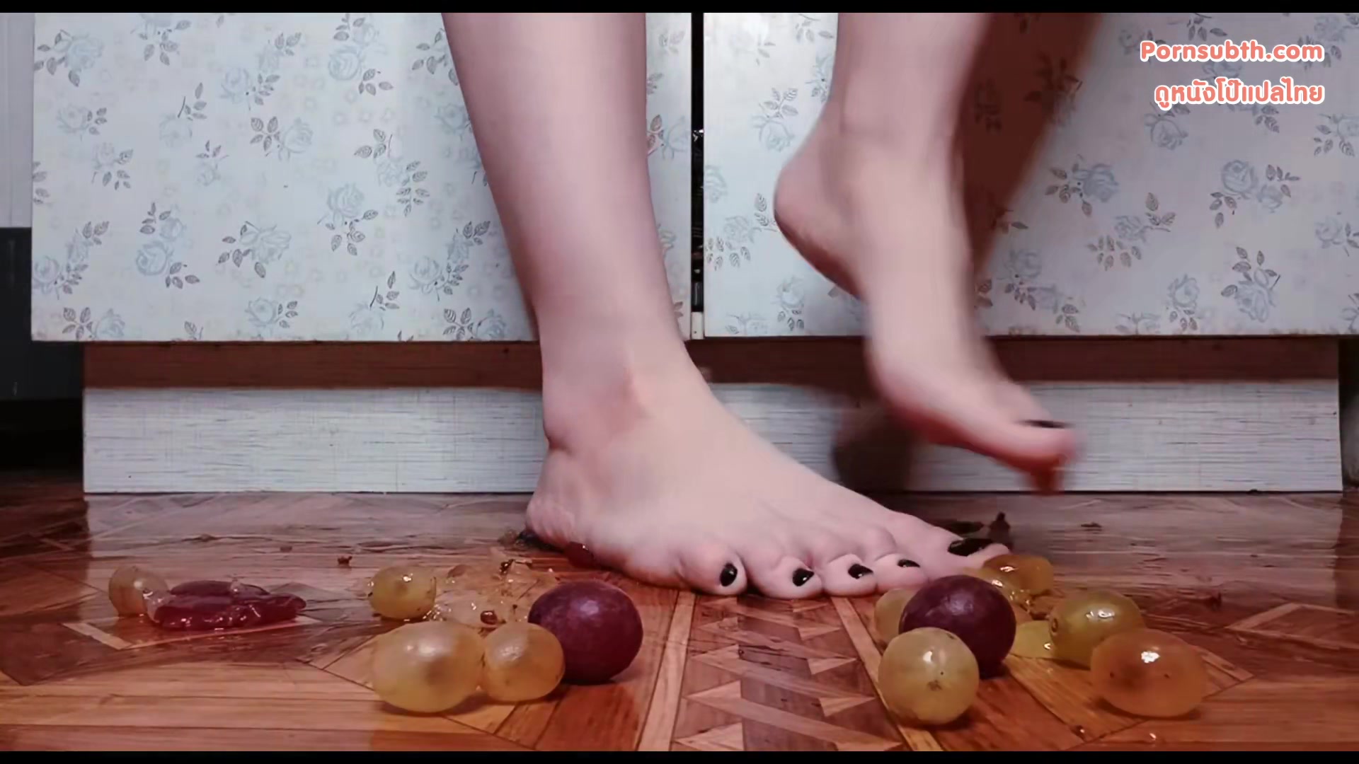 Lily Slutty - Female feet with black nail polish crush grapes